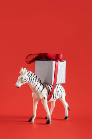 zebra toy carrying present boxの写真素材