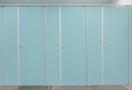 Clean men public toilet room empty with big window, interior.