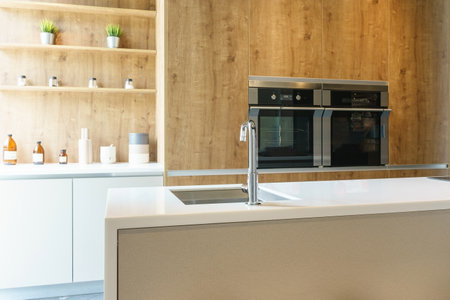 Bright modern kitchen with stainless steel appliances. Interior design.