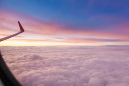 Blurred background sky at dusk view from window airplaneの写真素材