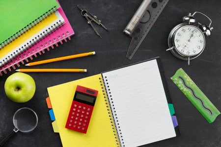 Flat lay educational elements arrangement with empty notepad