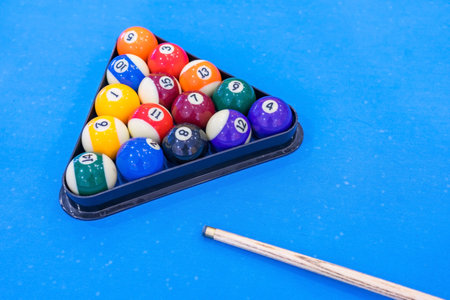 Balls for billiards pool snooker are on blue table, preparation for game
