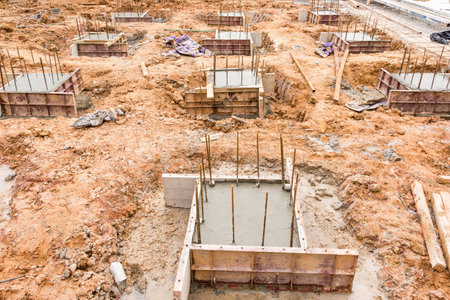 Concrete pillar construction in site,Temporary wood forms are used to form concrete poured in place...