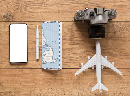 Top view traveling items on wooden backgroundの写真素材