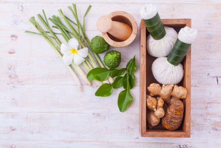Natural Spa Ingredients . The herbal compress ball and massage oil for spa treatment.の写真素材