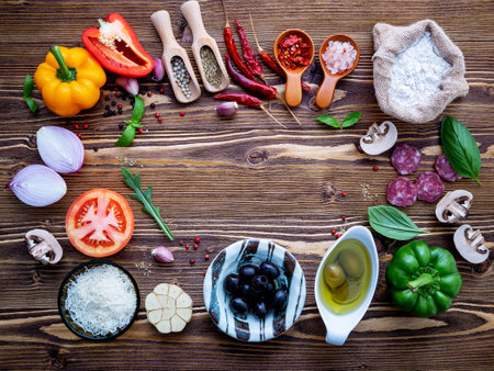 The ingredients for homemade pizza on shabby wooden background.の写真素材
