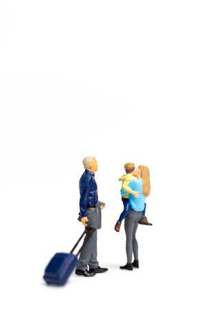 Miniature people Happy family standing on white background and copy space for textの写真素材