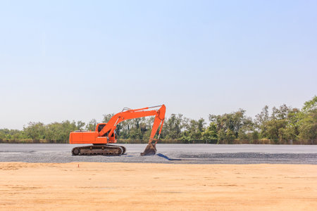 Excavators machine on a construction site on a construction site against blue sky background