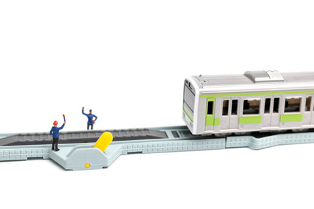 Miniature people : Railway staff are working at railway on white background