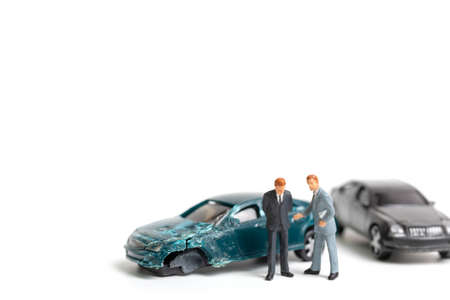 Miniature people : Accident scene, car crash on white backgroundの写真素材