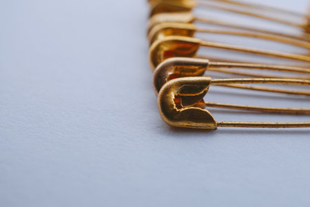 a gold safety pinsの写真素材