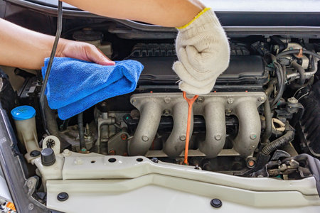 Checking the oil level in a car engine, Selective focusの写真素材