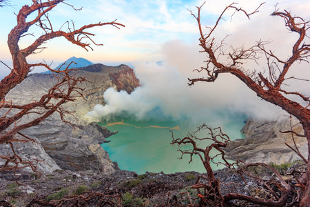 Panoramic view of Kawah Ijen Volcano at Sunrise. The Ijen volcano complex is a group of...