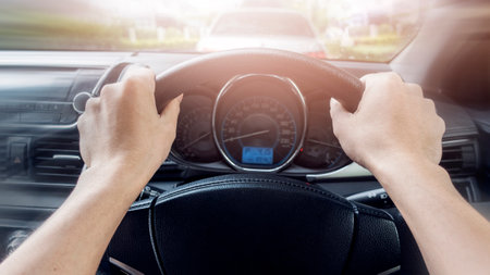 Close up of man hand control wheel