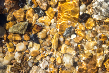 colorful pebbles under water sea for the background