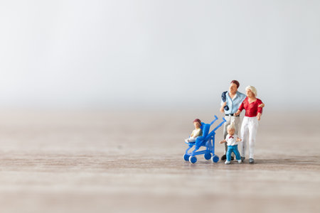 Miniature people : Parents with children walking outdoor , Happy family conceptの写真素材