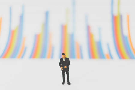 Miniature people businessman standing on chartの写真素材