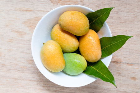 Close up Wild mango on wooden background