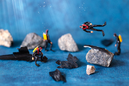 Miniature people , Scuba diver cleans up plastic rubbish pollution discarded in ocean, underwater pollution conceptの写真素材
