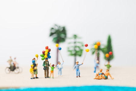 Miniature people : happy family enjoy summer vacation on the beachの写真素材