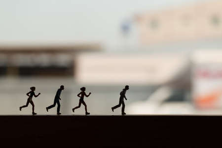 Miniature people: Silhouette of a runner , Health And lifestyle concepts.の写真素材