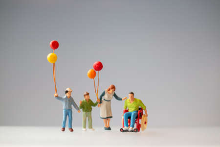 Positive family taking care of their disabled Father