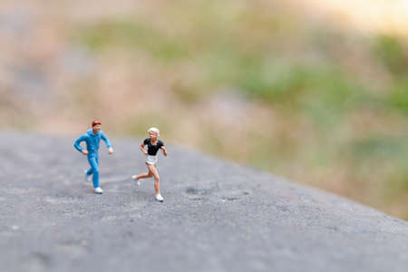 Miniature people Running on The Rockの写真素材