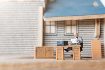 Miniature Business people Working at Home to Protect Himself From Virus
