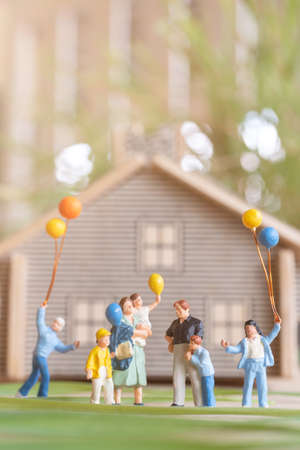 Miniature people , Happy family playing in backyard lawnの写真素材