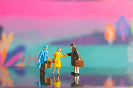 Tourist handshake with friend on colorfull background