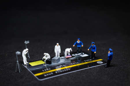Miniature people : Police And Detective finding proof from credit card
