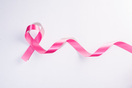 Pink ribbon cancer sign on whiteの写真素材