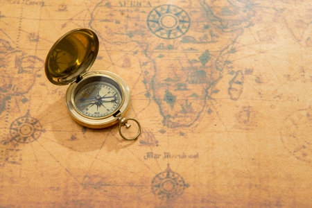 old compass on vintage map