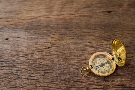 Old Compass on wood background