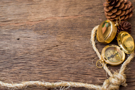 Old Compass and rope on wood backgroundの写真素材