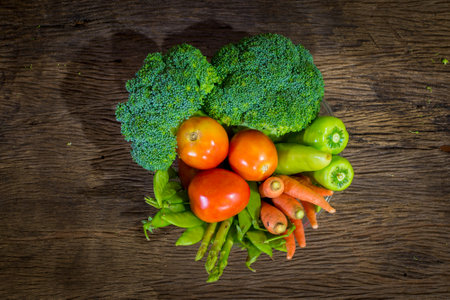 green vegetables on wood backgroundの写真素材