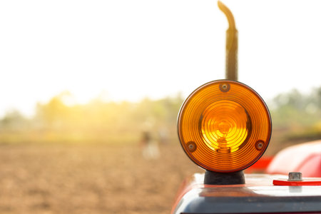 Turn Signal for Tractor on field backround.の写真素材