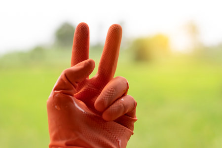 Two finger of famer on nature background.の写真素材