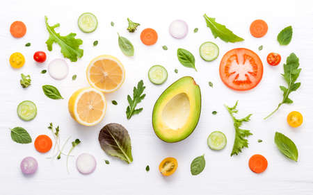 Food pattern with raw ingredients of salad. Various vegetables lettuce leaves, cucumbers, tomatoes,...