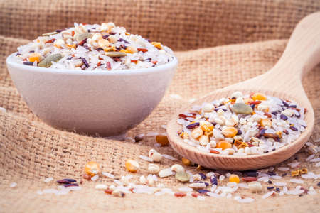 Mixed Whole grain Traditional Thai rice best rice for healthy and clean food on hemp sacks backgroundの写真素材