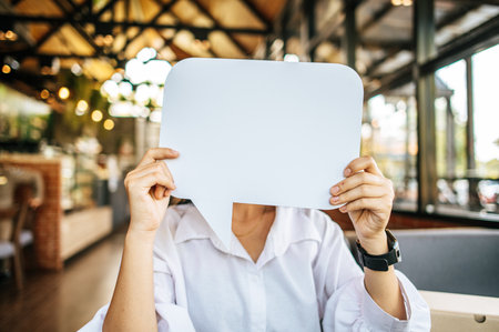 woman holding speech bubble rectangle with conners rounded