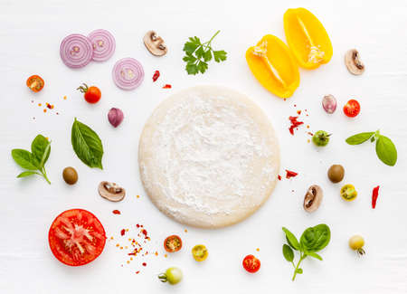 The ingredients for homemade pizza on white wooden background.の写真素材
