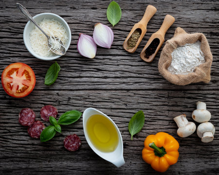 The ingredients for homemade pizza on shabby wooden background.の写真素材