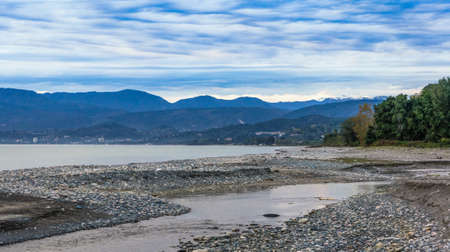 Seascape with cloudy sky over the coast.