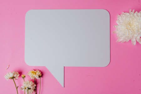 blank speech rectangle with conner rounded and flower on pink background