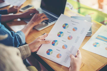 team business woman hands working and holding business graph information diagram.の写真素材