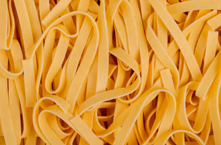 top view of tagliatelle pasta as backgroundの写真素材