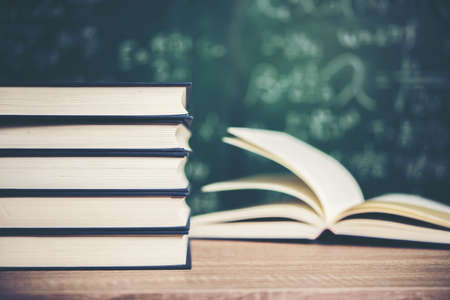 Open book with green board background