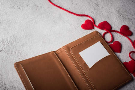 Top view Blank white card on wallet and heart gift