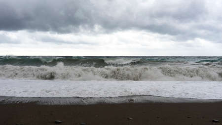 Seascape with a storm in cloudy weather.